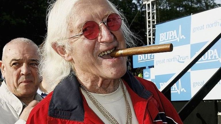Carlos III con Jimmy Savile